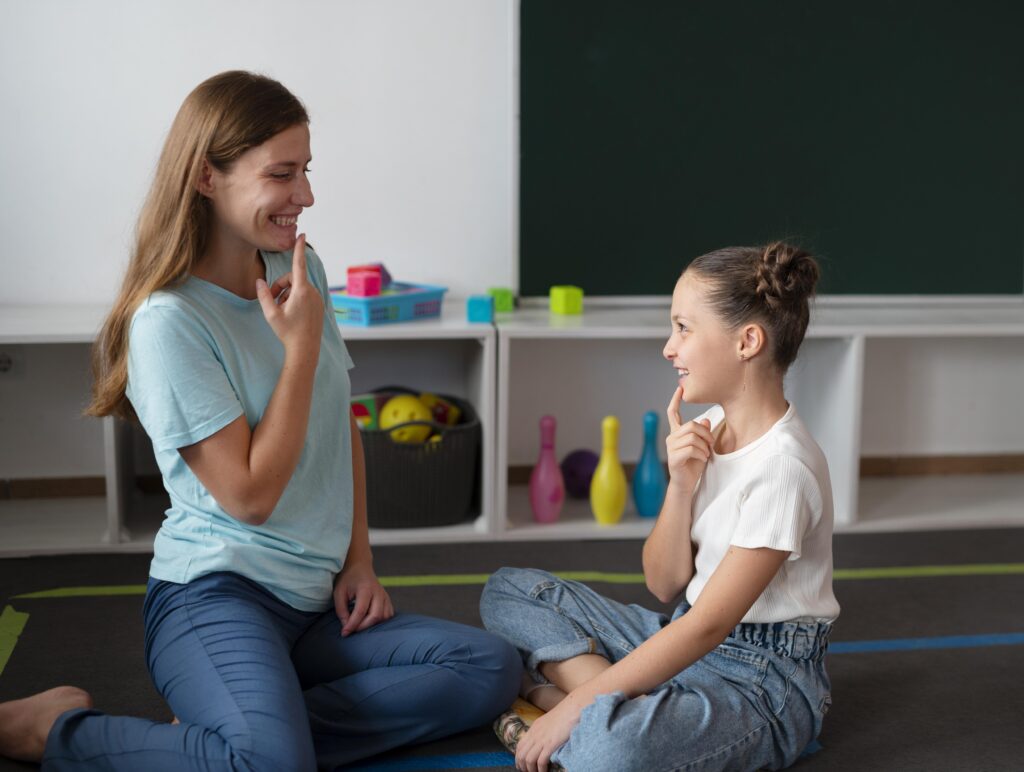 psychologist helping little girl speech therapy